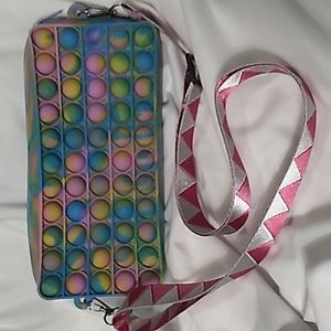 7.5 x 3.5 x 1 3/8 inches Rainbow Pop It Bag